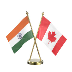 Canada and India Cross Desk Flag with Brass Base and Pole
