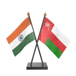 Oman and India Cross Desk Flag with Black Acrylic Pole and Base