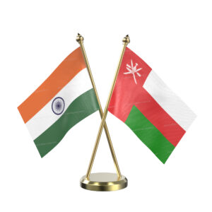 Oman and India Cross Desk Flag with Brass Base and Pole